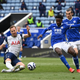 Harry Kane of Tottenham Hotspur fires in a shot past Wilfred Ndidi of Leicester City during the Premier League match between Leicester City and Tottenham Hotspur.